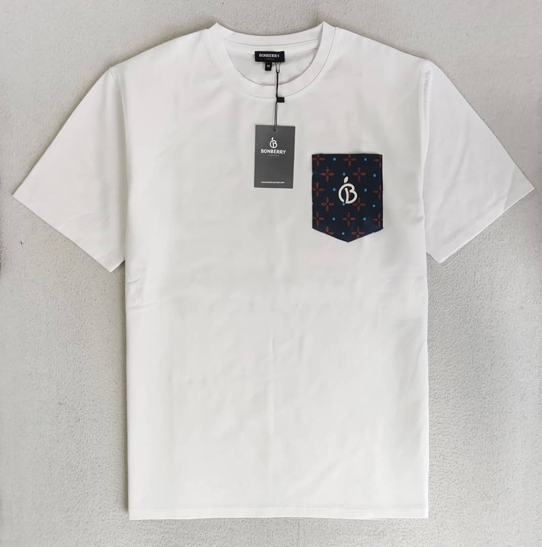 white t-shirt with a pocket in blue and gold stars